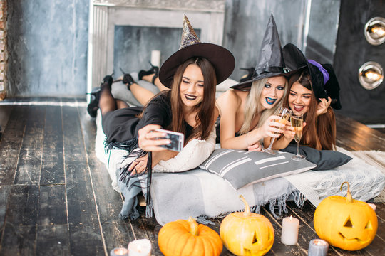 Spooky female friends posing on the selfie