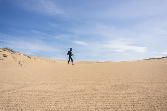 Man walking on sand, Arbus, Sardinia, Italy, Europe