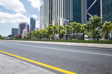 empty asphalt road with modern buildings
