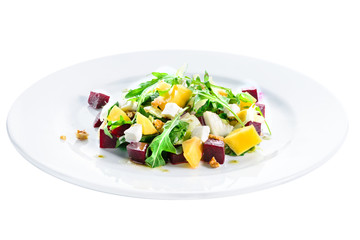 Delicious and appetizing salad with avocado, cheese and lettuce in a white plate isolated on white background. Autumn menu in an Italian restaurant. Photo for menu design