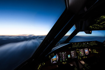 Airliner Cockpit in Flight  - obrazy, fototapety, plakaty