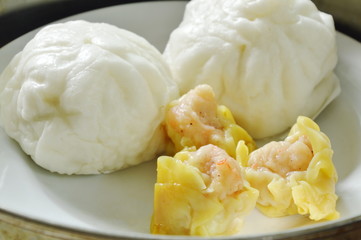 Chinese steamed bun stuffed minced pork and Dim sum on pot