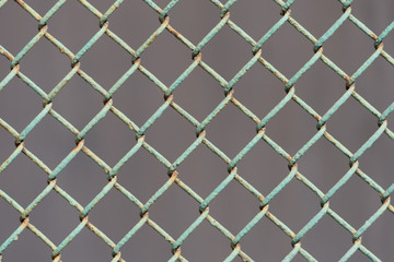 Naklejka premium old metal fence on a dark background.