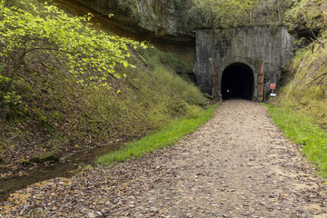 Fototapeta na wymiar Bike Trail Tunnel - A former railroad line turned bike trail with a tunnel.