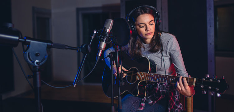 Female singer performing a song in studio