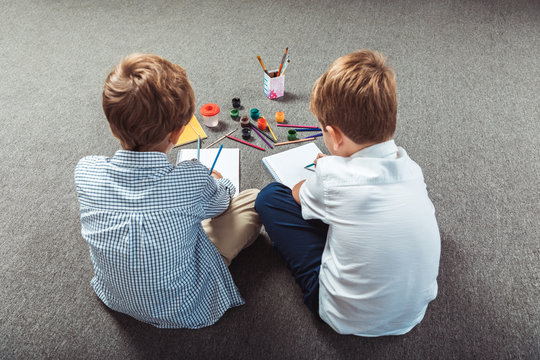 little boys drawing together