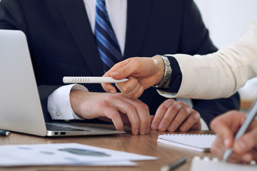 Fototapeta premium Group of business people or lawyers at meeting, hands close-up