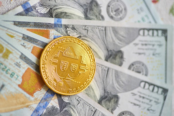Golden Bitcoins on US dollars. Electronic money exchange concept