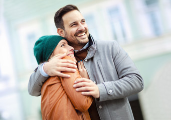 Smiling couple in love outdoors.Young happy couple hugging on the city street.