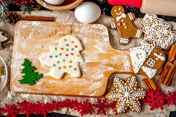 cooking christmas gingerbread on wooden background top view