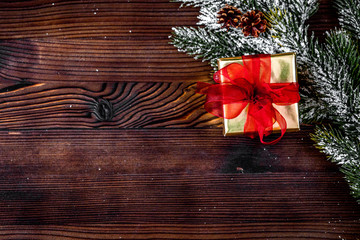 packaging christmas gifts in boxes on wooden background top view