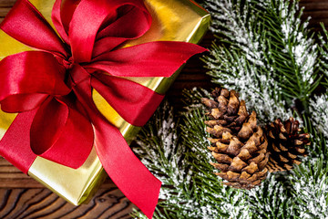 packaging christmas gifts in boxes on wooden background top view