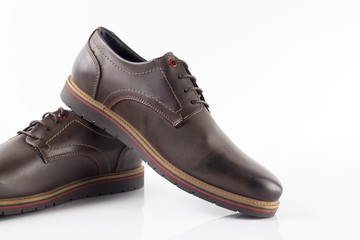 Male brown leather shoe on white background, isolated product, comfortable footwear.