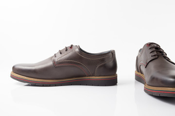 Male brown leather sandal on white background, isolated product, comfortable footwear.