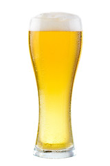 Wet glass of fresh cold light beer with foam isolated on white background