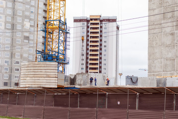 Builders work at the construction site