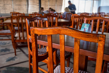 Cafe interior with wooden tables and chairs
