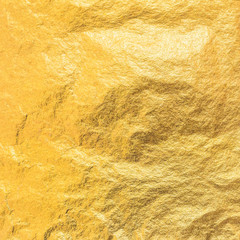 Gold foil leaf metallic wrapping paper shiny texture background for wall paper decoration element