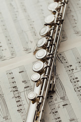 transverse flute on music sheet © nikkytok