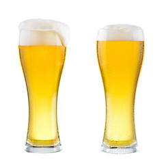 Two wet glasses of fresh cold light beer with foam isolated on white background