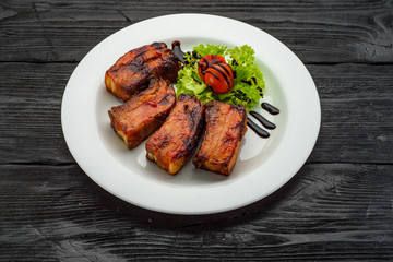 Grilled Fish Fillet over dark wooden background