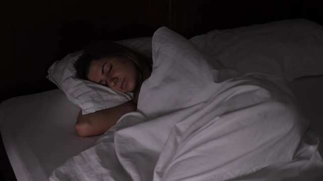 Woman Sleeps In Bed In The Dark Quickly Dawning, The Light Interferes With Sleep
