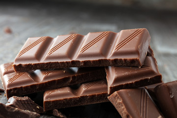 Dark Chocolate chunks and stacked broken chocolate bar.