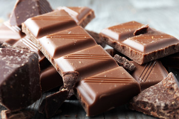 Dark Chocolate chunks and stacked broken chocolate bar.