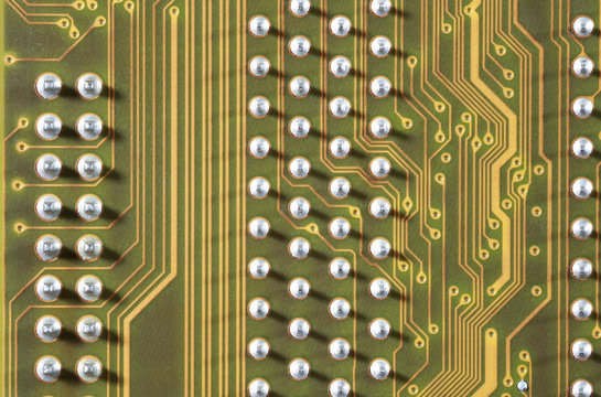 close-up of electronic circuit golden board background of computer motherboard.