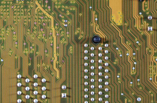 close-up of electronic circuit golden board background of computer motherboard.
