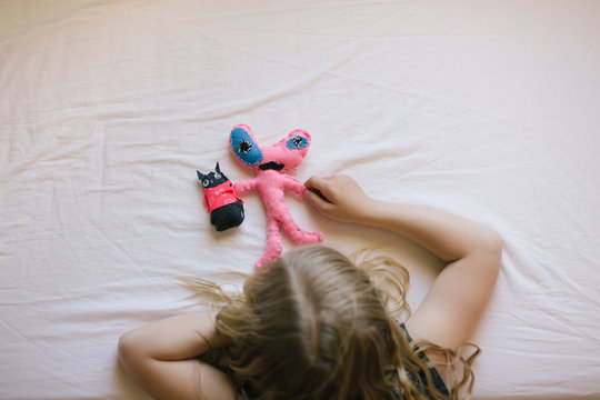 Girl playing handmade teddy bears