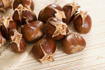 roasted chestnuts on wooden background