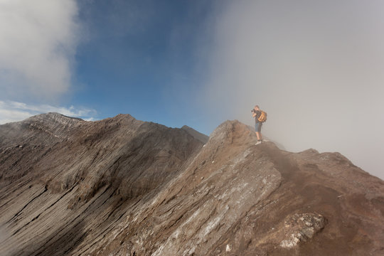 Man standing at Rim of Mount Bromo