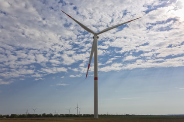 Big wind power turbine on the field