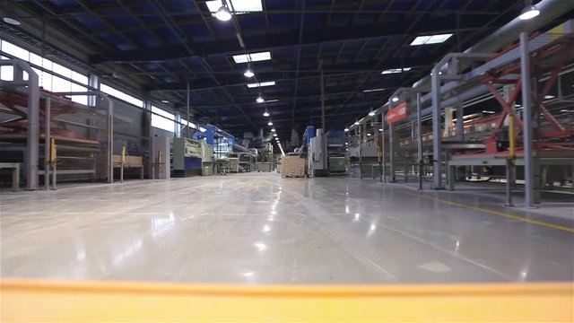 Autonomous loading machine, Loading machine with artificial intelligence, automatic transporter in the factory, view from the cockpit, close-up, modern factory, interior, conveyor