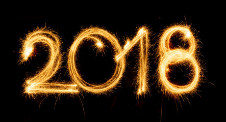2018 with sparklers on black background
