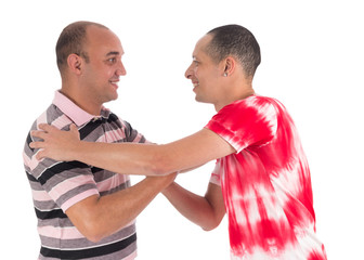 Friends greet each other warmly. Handshake. White background..