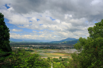 Lake among Mountain Tropical Forest against Sky in Vietnam