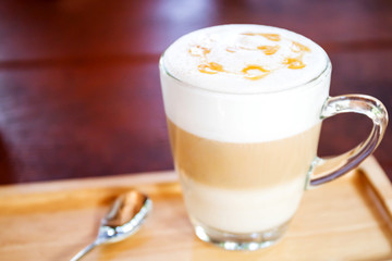 Hot coffee in a white cup on table