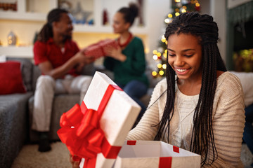 Girl opening box with Christmas gift