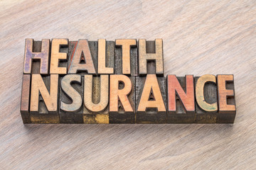 health insurance word abstract in wood type