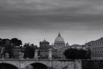 Fototapeta premium view of the bridge and the basilica of St. Peter in black and white with a sky-blue sky