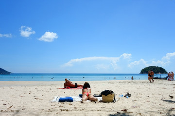 Fototapeta na wymiar Woman Sunbathing on the Beach