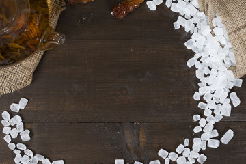 Candy sugar in a pouch scattered on a table close up with space for text
