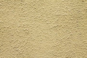 yellow textured wall with plaster