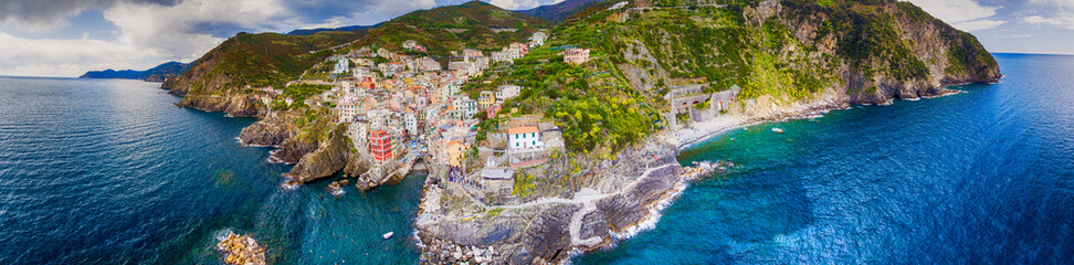Aerial panoramic view of Riomaggiore from the Sea, Five Lands - Liguria - Italy