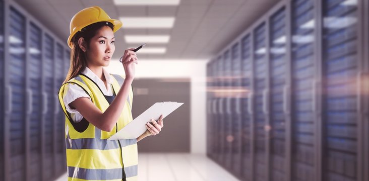 Composite image of architect woman with yellow helmet and plans