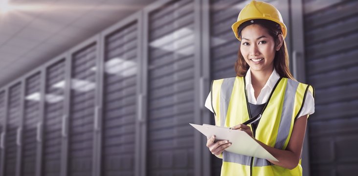 Composite image of architect woman with yellow helmet and plans