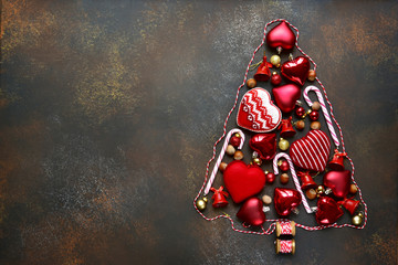 Abstract christmas tree made from red christmas toys.Top view.