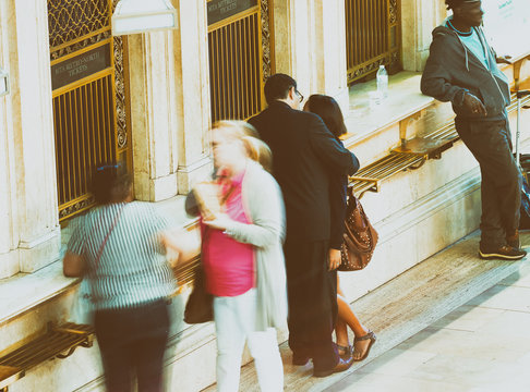 NEW YORK CITY - JUNE 2013: People move along the Interior of the main concourse at historic Grand Central Terminal - Powered by Adobe
